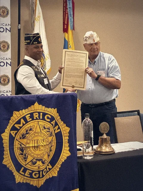 Commander Brian Scott Smith receives the charter for General Colin L. Powell Post #809
