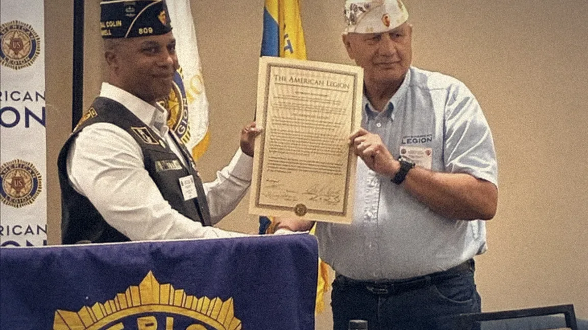 Commander Brian Scott Smith receives the American Legion charter for General Colin L. Powell Post #809